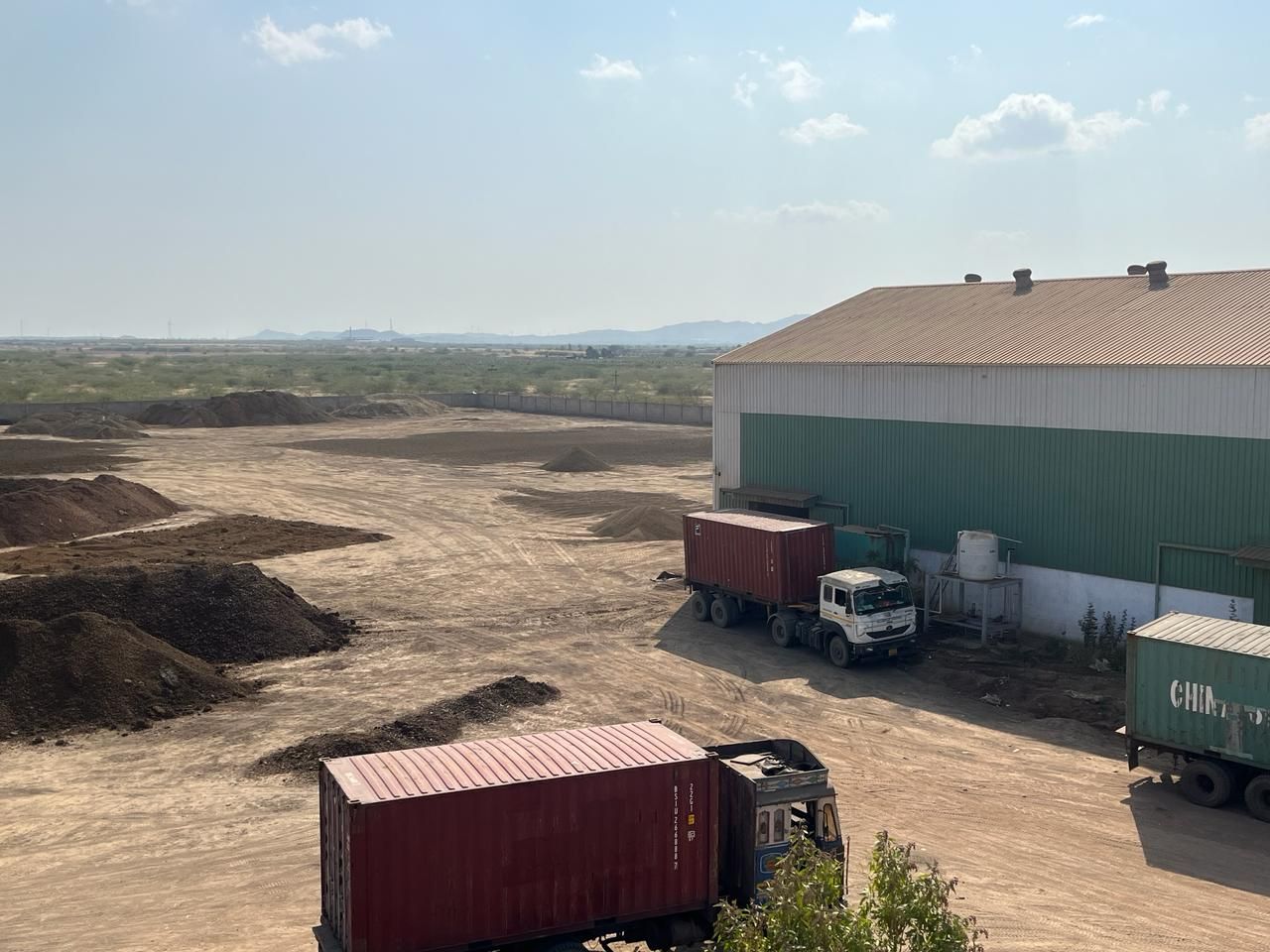 Containers and trucks at the plant yard
